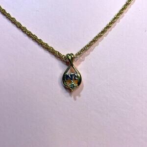 - Nina Ricci Necklace 1/4in Pendant on a 14 in Chain Gold tone Chain